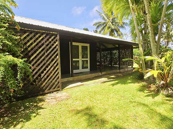 Shady verandah on two sides of the house surrounded by trellis for privacy