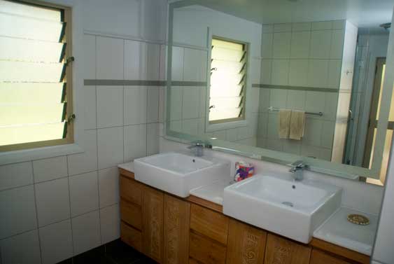 the large bathroom and shower area