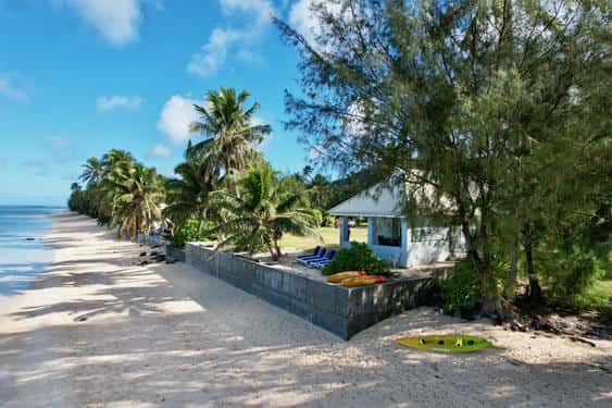 exterior view showing blue lagoon and white sand beach