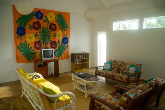 furnished living area, with wall hanginging and TV