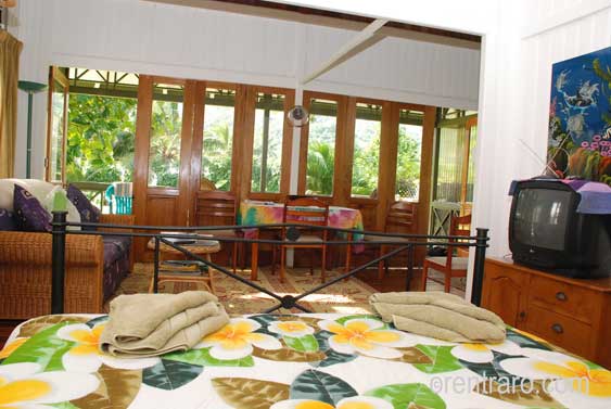 view from the bed to the living area and through the french doors. 