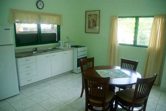 The kitchen is open plan and blends into the dining area.